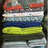 Pile of folded Dark Citron cotton duck fabrics — preshrunk medium-weight canvas showing even color saturation.