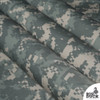 Digital camo ripstop fabric folded diagonally highlighting reinforced ripstop grid pattern and tactical outdoor fabric durability.