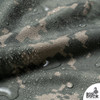 Lightweight digital camo nylon ripstop fabric folded in soft waves showing smooth slick surface and camouflage pattern.