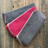 Small zippered pouch made from Charcoal Grey cotton canvas — durable 10oz duck cloth with deep grey color and minimalist style.