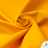 10oz Yellow Cotton Duck Cloth — Heavy-Duty Cotton Canvas by the Yard Close-up of durable yellow 10oz cotton duck fabric, emphasizing breathable weave and bright, cheerful tone.