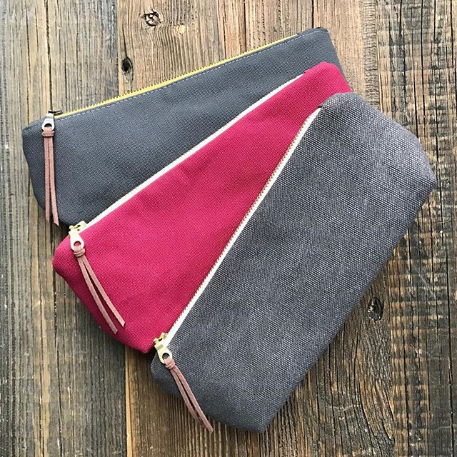 Small zippered pouch made from Charcoal Grey cotton canvas — durable 10oz duck cloth with deep grey color and minimalist style.