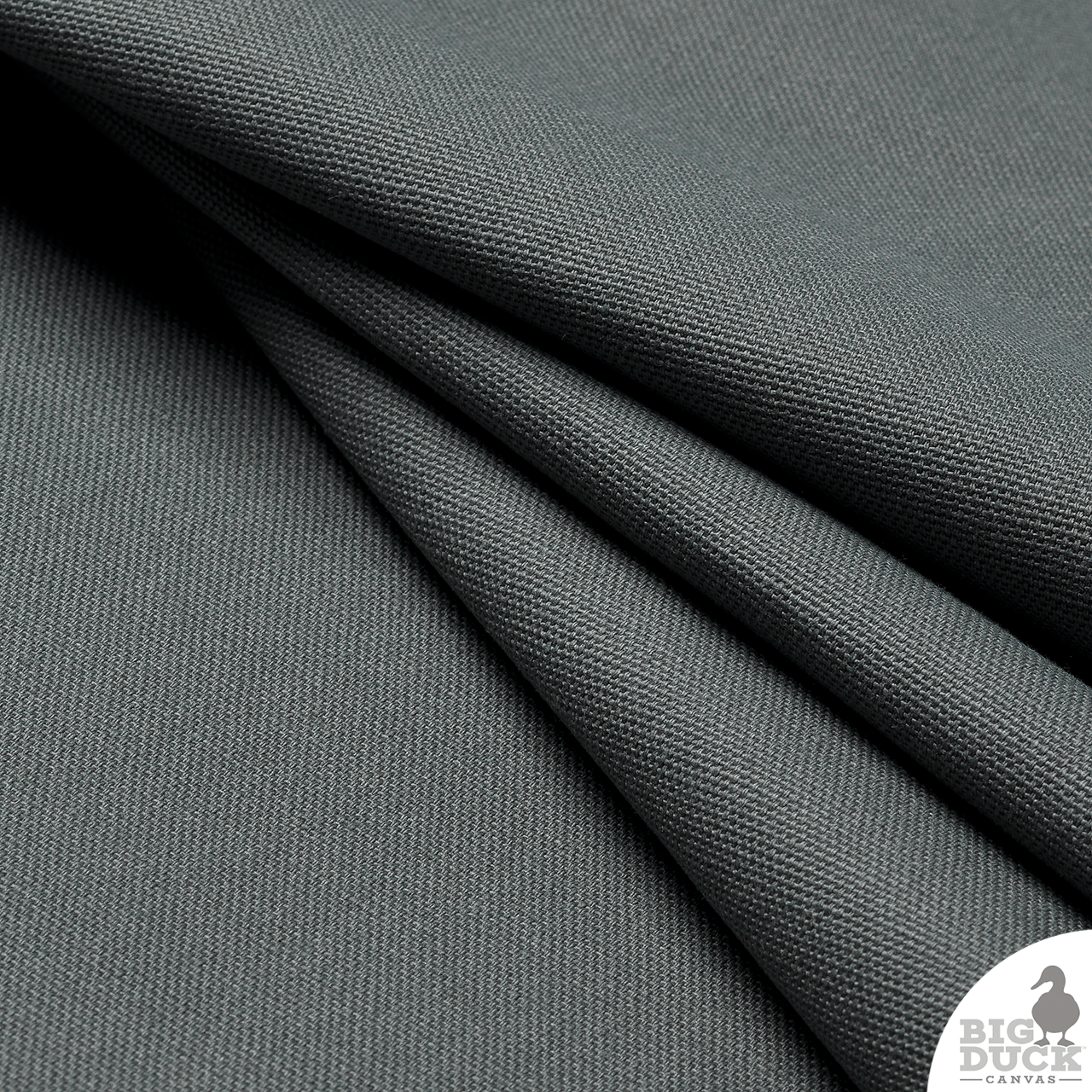 Folded yard of Charcoal Grey canvas — 100% cotton, medium-weight duck cloth ready for sewing and upholstery.