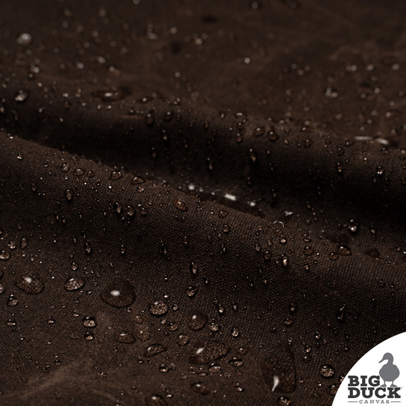 Water droplets beading on Kona Brown Waxed Canvas Fabric — Waterproof and Durable Non-Toxic Waxed Cotton Duck Material for Outdoor Projects Water droplets beading on Kona Brown Waxed Canvas Fabric — Waterproof and Durable Non-Toxic Waxed Cotton Duck Material for Outdoor Projects