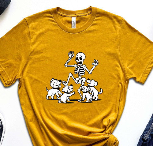 Puppies harassing skeleton in the color mustard yellow closeup Puppies harassing skeleton in the color mustard yellow closeup