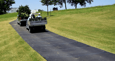 https://cdn11.bigcommerce.com/s-521ruvu/products/12506/images/18229/vm28_checkers-2x8-versamat-ground-protection-mat-landscaping-vehicle-driving-on__24189.1665222570.450.450.png?c=2