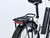 Stylish Sparkling White Raleigh Motus eBike featuring integrated lighting, mudguards and a modern low-step aluminium frame.