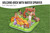 Fun dinosaur-themed paddling pool featuring a volcano arch, inflatable palm tree and interactive water play for young children.