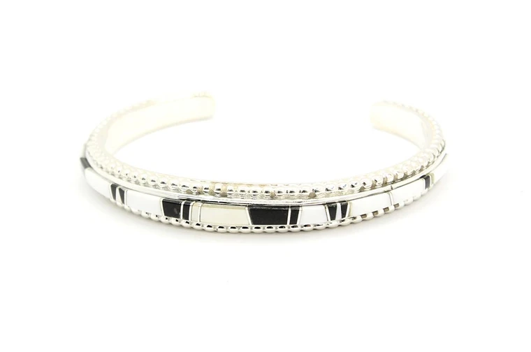 Sterling silver cuff bracelet inlaid with white White Buffalo stone and black onyx
