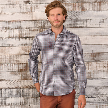 Man wearing a button up flannel check shirt.