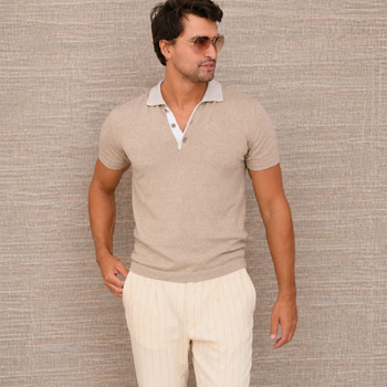 Man wearing a tan colored Pima cotton polo.