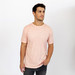 Man wearing a short sleeve pink cotton crew neck shirt.