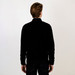 The back view of a man wearing a cashmere cardigan.
