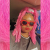 Celestine wearing faux locs made in Pink Ombré