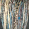 Dreads made by Caitlin in Electric Teal, Persian Orange, and Seashore Ombré