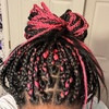 Zozo wearing braids in 1 Black and Hot Pink