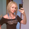 Customer Lizzie wearing synthetic dreads made from 22 Ash Blond and Turquoise kk jumbo braid