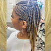 Kie wearing braids in T27/613 Mixed Blond with Platinum Tips, installed by SBK Hair