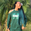 Alexia wearing braids made from Off Black with Ocean Green Tips