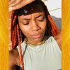 Chauna wearing braids in Burnt Orange, Copper, Rustic Pink, and Rustic Red