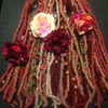 Faux locs made by Shaymon in Crimson, Dark Cherry Red, Dusty Rose, English Rose, Ice Pink, Peach Bloom, Rose, Rose Gold, and Vintage Pink