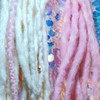 Synth dreads made by RoboKitty in White Cotton Candy and Pink Cotton Candy.