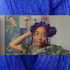Desirea wearing braids and space buns in Sea Blue