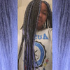 Alexis wearing braids in 1B Off Black with Electric Blue Tips