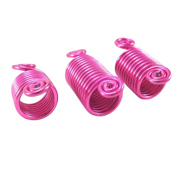 Side view of small, large, and medium coil hair jewels in Fuchsia