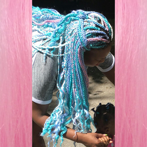 Jawaya wearing glow in the dark braiding hair, Festival Braid in Light Pink,  and kk jumbo braid in Periwinkle Blue and Sky Blue