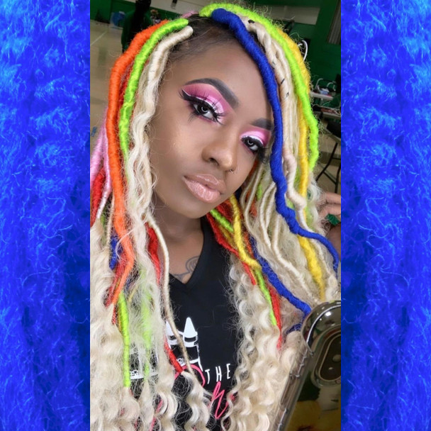 Faux locs using Red, Orange, Yellow, Neon Lemon Lime, Navy Blue, and Powder Pink marley braid, installed by Bre'Shell