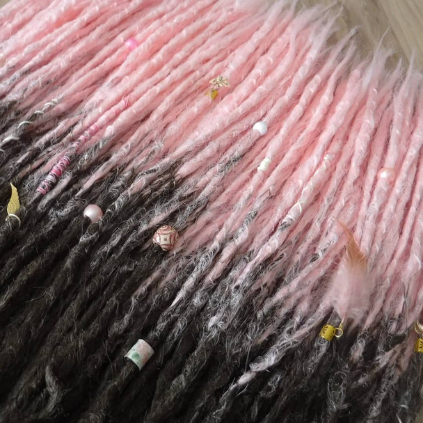 Synthetic dreads made from Dreadnaughty LLC in 4 Dark Brown and Pastel Pink