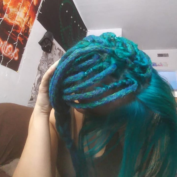Synthetic dreads made by Dread The Thought in 1B Off Black/Emerald Green Mix, Bright Petrol Green, Midnight Blue, and Peacock