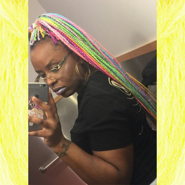Candace wearing braids in Baby Pink, Lavish Purple, Light Blue - Soft, Neon Lemon Lime, Neon Violet, Orchid, Pastel Green, Pastel Pink, Pastel Yellow, Peach, Periwinkle Purple, and Sky Blue.