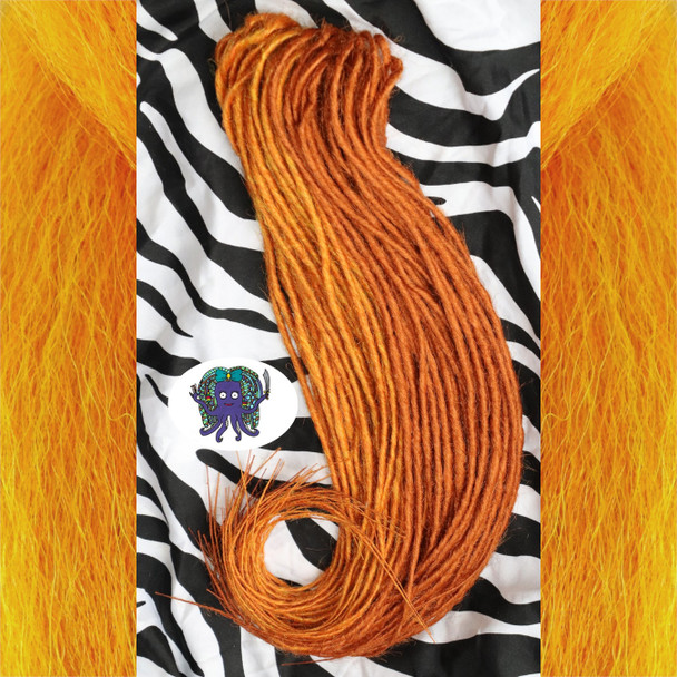 Synthetic dreads made by Morgane in Amber and Orange Spice