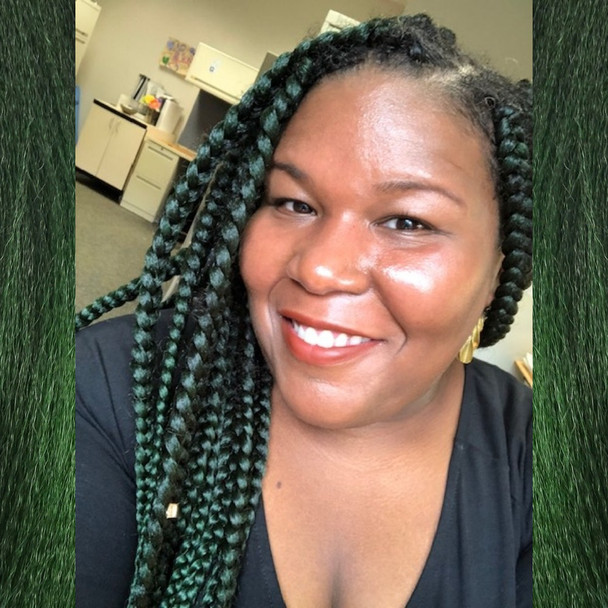Erica wearing braids in 1B Off Black with Jungle Green Tips