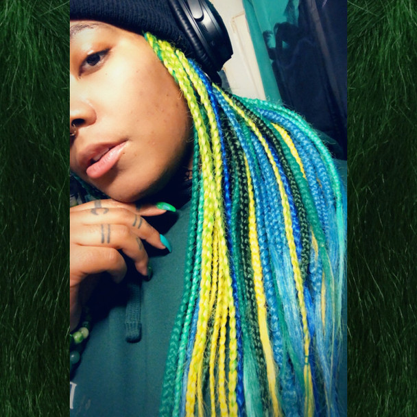 Hen wearing braids in Bright Petrol Green, Cobalt Blue, Jungle Green, Lemon Lime Ombré, and Light Petrol Green