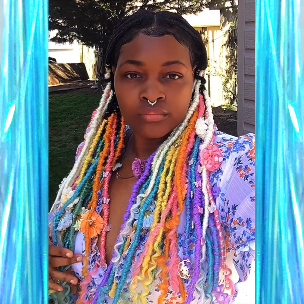 Faux locs made by Shaymon with tinsel in Bright Blue, Canary, Grass Green, Sherbert, and White