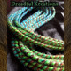 Synthetic dreads made by Dreadful Kreations in T2/8/27 Brown Ombré, Lime Green, and Turquoise