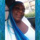 Deja wearing braids in Navy Blue, Petrol Green, and Turquoise