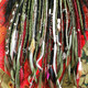 Synthetic dreads by Dawna in Moss Green, Olive Green, and Pistachio