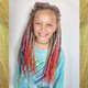 Synthetic dreads made by Candida in 24 Dark Blond, Platinum Blonde, and Rainbow