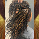 Katira wearing braids made from FS27/30/33 Caramel Mix