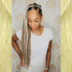 Kie wearing braids in 613 Platinum Blonde and T27/613 Mixed Blond with Platinum Tips, installed by SBK Hair