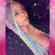 Alison wearing a mix of braids, twists, and wrapped dreads made from Mood Braid in Ice Sickle, Icy Blue, Italian Ice, and Pink Lemonade, and Festival Braid in Neon Pink, Candyfloss, Mojito, Pale Blue, Pastel Blue, Pure White, Rainbow, Sea Lavender, and Snow Pink