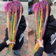Synthetic dreads by Magick Mel in Citrus Orange, Grass Green, Hot Purple, Neon Pink, Neon Rainbow, and Neon Yellow