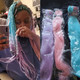 Lee wearing braids in Pastel Lilac, Pastel Pink, and Sea Glass