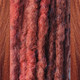 Synthetic dreads made by Savanna in 350 Rusty Red and Rustic Red