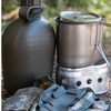 1 qt canteen, cup, and stove in the grass with the ACU pouch 