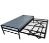 A black metal daybed frame with mattress with its pop-up steel trundle unit fully extended and elevated to equal height, demonstrating a space-saving guest bed configuration.